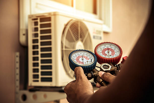 Professional Air Conditioning Service technician working in Hickory Valley, TN